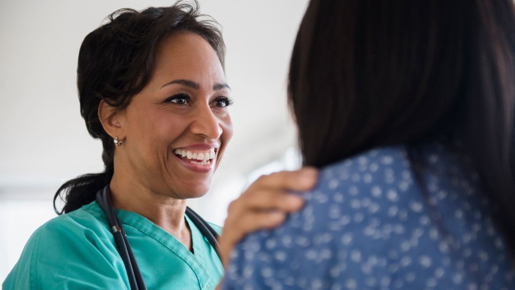 nurse smiling at a patient