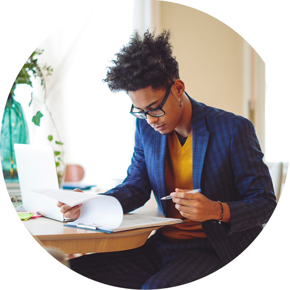 Professional Young adult Man looking at reports