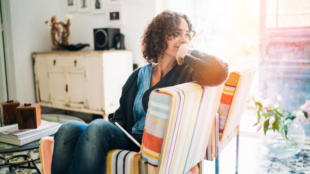 woman sitting in chair thinking