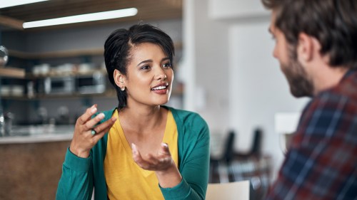 woman sharing ideas with man in office area