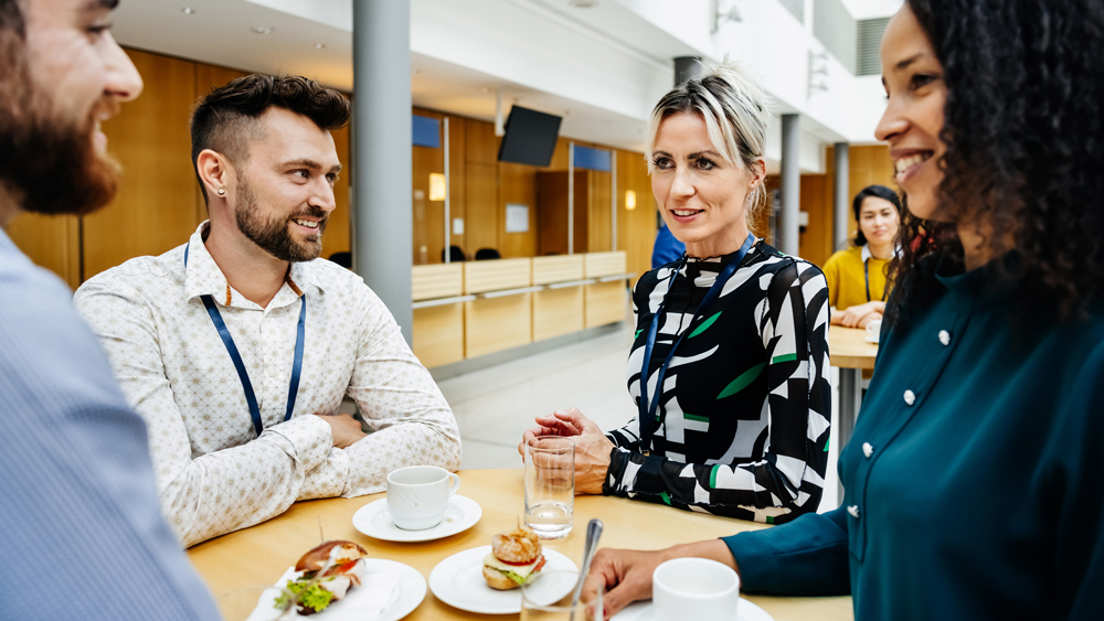 group of young professional having lunch together at a corporate training