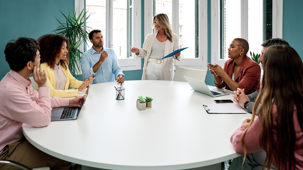 people around a table in a teambuilding workshop