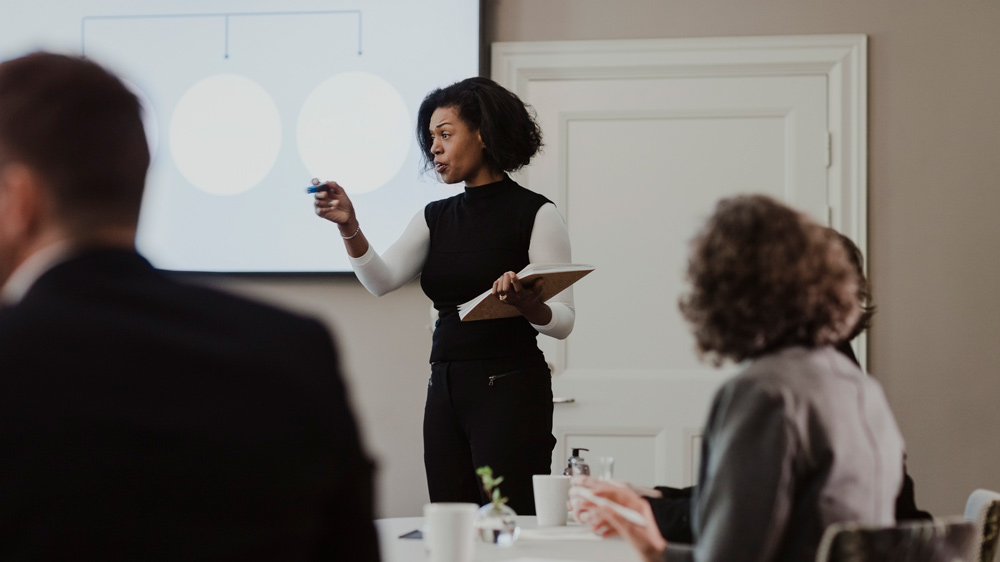 Businesswoman explaining in meeting at corporate office