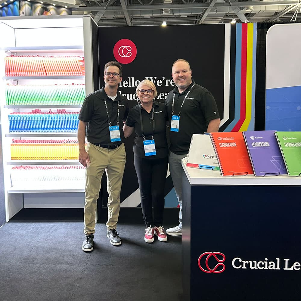 three employees at a fun tradeshow