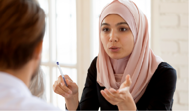 A woman having a serious conversation with a coworker