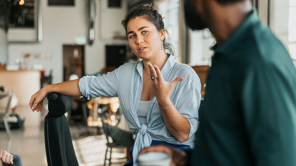woman talking to man in modern relaxed office