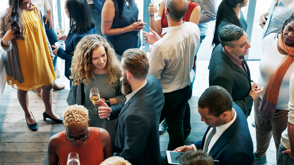 people mingling at work event